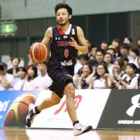 Japan guard Yuta Tabuse dribbles the ball during Friday's exhibition game against Czech Republic at Chiba Port Arena. The Czech Republic beat Japan 68-66. Czech Republic cagers edge Japan in exhibition