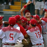 The Japanese team celebrates after winning the championship game at the Little League World Series on Sunday in South Williamsport, Pennsylvania. Japan rallies from record eight-run deficit to win Little League World Series