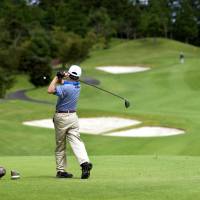 A player hits the links at the Miho Golf Club course in Miho, Ibaraki Prefecture. The nation's golf industry has mirrored its decades of economic stagnation and decline. Numbers of players are down 30 percent from the heyday in the early 1990s. Golf's slide in Japan sees course owners taking a swing at noncorporate clients