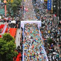 Runners begin the 2009 Shanghai International Marathon. Toray Industries Inc. has returned to sponsor the event after three years of absence that reflected strained diplomatic ties between Japan and China. Toray resumes sponsorship of Shanghai marathon after three-year absence