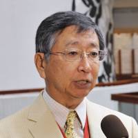 Koji Tsuruoka, Japan's chief negotiator for Trans-Pacific Partnership multilateral trade talks, speaks to reporters at a hotel before a meeting with his counterparts in Atlanta on Saturday. Chief TPP negotiators race to wrap up broad trade deal