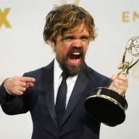 Actor Peter Dinklage poses backstage with his award for Outstanding Supporting Actor in a Drama Series for his role in HBO’s “Game of Thrones” during the 67th Primetime Emmy Awards in Los Angeles on Sunday. 'Veep,' 'Game of Thrones' sweep fresh air into Emmy Awards