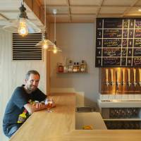 Beer magician: Mikkel Borg Bjergso, who runs Danish microbrewery Mikkeller, sits at the counter to his newest bar, which opened in August along a backstreet of Tokyo's Shibuya district. Denmark's Mikkeller hits Tokyo, leaves strange brews