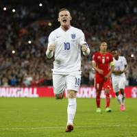 Wayne Rooney celebrates after becoming England's all-time scoring leader on Tuesday in London. Rooney sets new England scoring mark