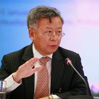Jin Liqun, set to become the first president of the Asian Infrastructure Investment Bank, speaks at the Asian Development Bank Regional Forum in Manila in 2010 in his former capacity as chairman of China Investment Corp.’s supervisory board. AIIB's Jin visited Japan quietly in 2014, still hopes it will join bank