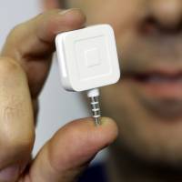 Square’s credit card reader for smartphones is shown in January. The financial services startup, founded in 2009 by Twitter co-founder and CEO Jack Dorsey, announced Wednesday it has filed with U.S. regulators for a stock market offering to raise $275 million. Square files for keenly awaited stock market debut