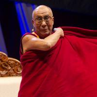 Tibet’s exiled spiritual leader the Dalai Lama, shown speaking in Toronto in October 2010, is viewed by Beijing as leading a “reactionary clique splitting the motherland.” China uses intimidation tactics at U.N. to silence critics