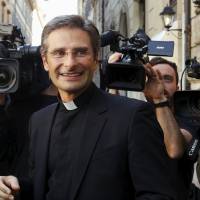 Monsignor Krzystof Charamsa leaves a news conference in downtown Rome on Oct 3. The Vatican dismissed him from his post in a Holy See office on Saturday after he told a newspaper he was gay and urged the Catholic Church to change its stance on homosexuality. Vatican fires gay priest on eve of synod