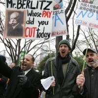 Not protected: English teachers attend a rally for workers' rights in Tokyo in 2005. The McLean case established that foreign residents in Japan can be denied visa renewal due to their political activities. Japan’s Constitution won’t protect revolting foreigners
