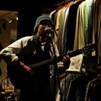 In-store live: A guitarist plays at a small shop called Tatsumakidou in Nagaoka, Niigata Prefecture. Since venues in Tohoku and its surrounding areas are often booked by major acts, indie musicians find other places to make themselves heard. Unexpected places step in to fill the role of live house venues in Japan's north