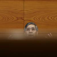Bank of Japan Gov. Haruhiko Kuroda speaks during a news conference at the central bank's headquarters in Tokyo last month. BOJ easing seen as blunt tool by one fund, blowing bubbles by another