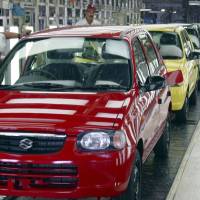 Engineers perform final checks on a Maruti Alto car at the automaker’s Gurgaon factory near New Delhi in 2003. Suzuki aims to take some Maruti turf in India