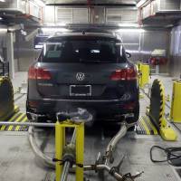 A Volkswagen Touareg diesel is tested Oct. 13 in the Environmental Protection Agency’s cold temperature test facility in Ann Arbor, Michigan. The U.S. government says Volkswagen cheated a second time on emissions tests, programming about 10,000 cars with larger diesel engines, including the 2014 Touareg, 2015 Porsche Cayenne and the 2016 Audi A6 Quattro, A7 Quattro, A8 and Q5, to emit fewer pollutants during testing than in real-world driving conditions. VW also used 'defeat devices' to break emission rules in larger diesel engines: EPA