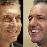 This combo photo shows opposition presidential candidate Mauricio Macri (left) and ruling party presidential candidate Daniel Scioli. Voting starts in key Argentina runoff election between Macri, Scioli
