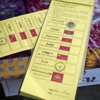 A ballot paper is seen at a polling station in Yangon on Sunday. Myanmar voters cast ballots in a historic election that could thrust democracy leader Aung San Suu Kyi’s pro-democracy party into power. Voting proceeds smoothly in Myanmar's first free election for 25 years