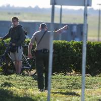 A Merced County Sheriff officer tells University of California, Merced, student Daniel Neff, 21, of Long Beach, to turn around after he tried to enter the campus, which is on lockdown following a stabbing Wednesday. First responders gun down knife-wielding assailant on California campus after he stabs five