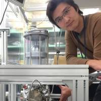 Tomohiro Nishitani, co-founder of Nagoya-based technology startup Photo Electron Soul, poses with its electron beam device. University-affiliated startup revolutionizes the electron beam
