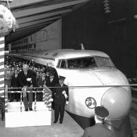 A ceremony is held at Tokyo Station to mark the launch of the Tokaido Shinkansen Line, Japan's first bullet train service, on Oct. 1, 1964. Grand bullet train system sought as expansion threatens slow, parallel routes