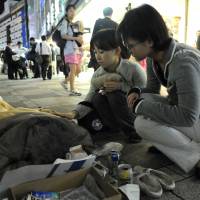 Medecins du Monde workers check up on the homeless in Tokyo. Medecins du Monde brings health care to Tohoku, Tokyo and the world