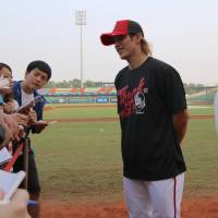 Taiwan's Daikan Yoh addresses the media after Friday's practice at the ongoing Premier 12. Taiwan's Yoh, Chen draw on experiences playing in NPB