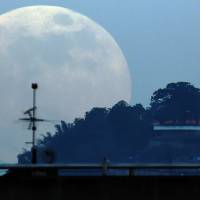 A supermoon is seen in September during the stages of a total eclipse in Caracas. Flashing some interplanetary gold bling and sipping space water might sound far-fetched, but both could soon be reality, thanks to a new U.S. law that legalizes cosmic mining. Obama signing of U.S. Space Act seen sparking cosmic gold rush