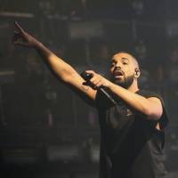 On top: Drake performs at the Austin City Limits Music Festival in Texas in October. The rapper was named Spotify's most streamed artist of the year, earning 1.8 billion streams. Drake is Spotify's most streamed artist of the year globally
