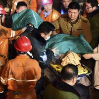 A miner is rescued from a collapsed gypsum mine in Pingyi County, east China's Shandong Province, on Friday. Chinese mine boss drowns himself after deadly collapse