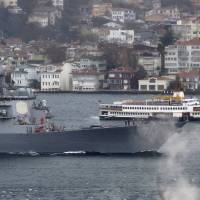 U.S. Navy guided-missile destroyer USS Ross sets sail in the Bosphorus strait, after returning from the Black Sea, in Istanbul Thursday. 11 more Syrians on fake passports held in Turkey in Islamic State plot against U.S. Consulate: report