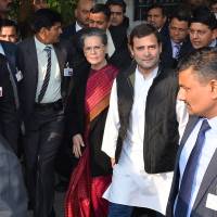 Rahul Gandhi, vice president of India’s Congress party (second right) walks with Sonia Gandhi, his mother and party president, and officials as they leave Patiala House Court in New Delhi on Saturday. Sonia, Rahul Gandhi, accused of illegally acquiring assets, make court appearance