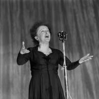 French singer Edith Piaf performs in 1960 on stage at the Olympia concert hall in Paris. One hundred years after her birth, Piaf remains an icon of Paris to the world, as shown by the many tributes to the capital through her songs after the attacks of Nov. 13. Events set to fete centennial of Edith Piaf's birth as alto's wail still resonates on both sides of Atlantic