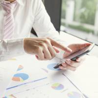 A businessman is seen working on his smartphone. More financial technology apps are becoming available, making the world of finance more accessible and user friendly. Fintech firms make inroads into the banking biz