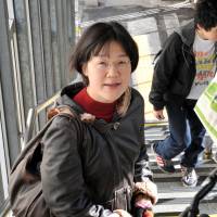 Kaori Oguni is suing the government over the constitutionality of a Civil Code provision that requires married couples to adopt one surname. She is seen on Nov. 17 in Tokyo’s Nakano Ward. Spouses await court ruling on retaining maiden name in marriage