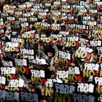 Summer of dissent: Protesters shout slogans at a rally against Prime Minister Shinzo Abe's administration in Tokyo in March. Can democracy survive the rise of the right?