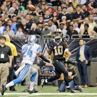 New Orleans wide receiver Brandin Cooks catches a touchdown pass in front of Detroit's Nevin Lawson on Monday. Lions hold on to beat Saints