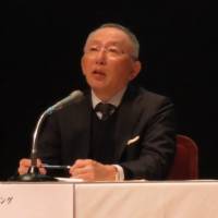 Fast Retailing Co. chief Tadashi Yanai speaks to students at Waseda University in Tokyo. Uniqlo chief tells young entrepreneurs to be persistent and set goals