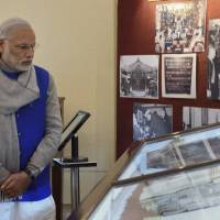 Indian Prime Minister Narendra Modi looks at documents displayed at the National Archives of India where he released the digital copies of 100 declassified files related to Netaji Subhash Chandra Bose in New Delhi on Saturday. India declassifies files on death of independence leader