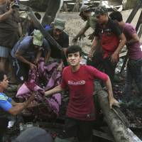 People carry the body of a victim killed in a truck bombing in Jameela market in the predominantly Shiite neighborhood of Sadr City, Baghdad, last August. According to a U.N. report released Tuesday, nearly 19,000 civilians have been killed in under two years. Iraqi civilian death toll 'staggering' just from violence since '14, topping 18,800, U.N. says