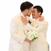 Wait for it: A couple hold an unofficial marriage ceremony in Tokyo in April. Different-names ruling leaves door open to possibility of same-sex marriages