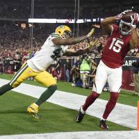 Arizona's Michael Floyd (15) catches a pass for a touchdown during the Cardinals' 26-20 win over the Packers. Cardinals shake off Packers in OT