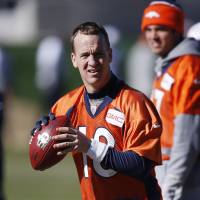 Peyton Manning looks to pass during practice on Thursday in Englewood, Colorado. The Broncos are preparing to face the Carolina Panthers in the Super Bowl on Feb 7. Manning not forthcoming on retirement talk