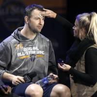 Montreal's John Scott waits for a television interview to begin as a makeup artist touches him up during the NHL's All-Star Game media day on Friday in Nashville, Tennessee. Bettman says Scott 'welcome' at All-Star Game
