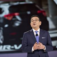 Takahiro Hachigo, president and chief executive officer of Honda Motor Co., speaks at the Detroit auto show in January. Honda chief rebuilds management team