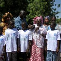 This handout picture obtained from the child's rights organization Plan International on Wednesday shows anti-gemale genital mutilation activist Madina Bocoum Daff (center) speaking during an anti-FGM drive event in Koulountabali on March 6, 2014. UNICEF: 200 million females subjected to genital mutilation is underestimate