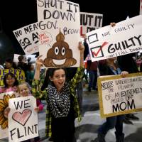People hold signs as they rally for the permanent shutdown of the Aliso Canyon natural gas storage facility near the Porter Ranch neighborhood in Los Angeles Feb. 19. The underground natural gas pipeline rupture that caused the largest-ever methane leak in California has been permanently capped, paving the way for thousands of displaced Los Angeles residents to return home, state regulators said on Thursday. At 100,000 tons, California methane blowout largest U.S. release ever