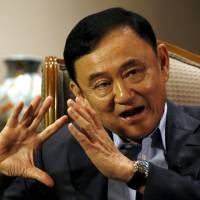 Former Thai Prime Minister Thaksin Shinawatra speaks during an interview Tuesday in Singapore. Ousted Thai leader Thaksin's influence shows signs of waning