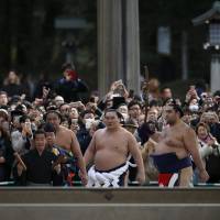 New year ritual: Mongolia-born grand sumo champion Hakuho makes a ceremonial appearance at Tokyo’s Meiji Shrine last month. The wrestler’s nationality will prevent him from running a stable after retirement. Does sumo commentary need to stress the foreignness of the wrestlers?