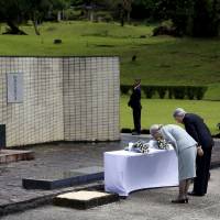Honoring the fallen: Japan’s Emperor Akihito and Empress Michiko bow their heads while paying tribute to Japanese soldiers who fought in World War II, at a memorial shrine in Cavinti, the Philippines. Imperial couple take stand for remembrance