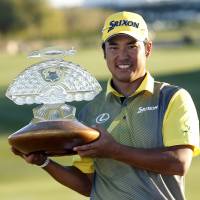 Hideki Matsuyama holds the trophy after winning the Phoenix Open on Sunday. Matsuyama wins Phoenix Open