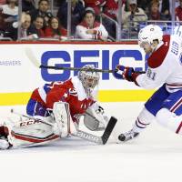Washington goalie Philipp Grubauer deflects a shot by Montreal’s Lars Eller in the second period on Wednesday night. The Canadiens edged the Capitals 4-3. Galchenyuk scores pair as Canadiens edge Capitals