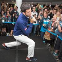 Novak Djokovic sings for fans after the Australian Open final on Sunday in Melbourne, Australia. Djokovic still hungry after latest triumph